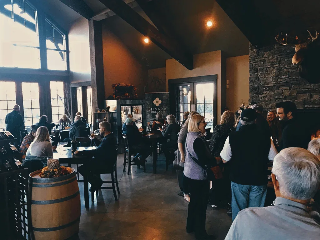 Guests gathered inside the winery at Silvara Cellars during an evening event